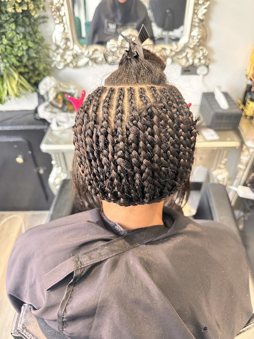 Neat knotless braids styled back