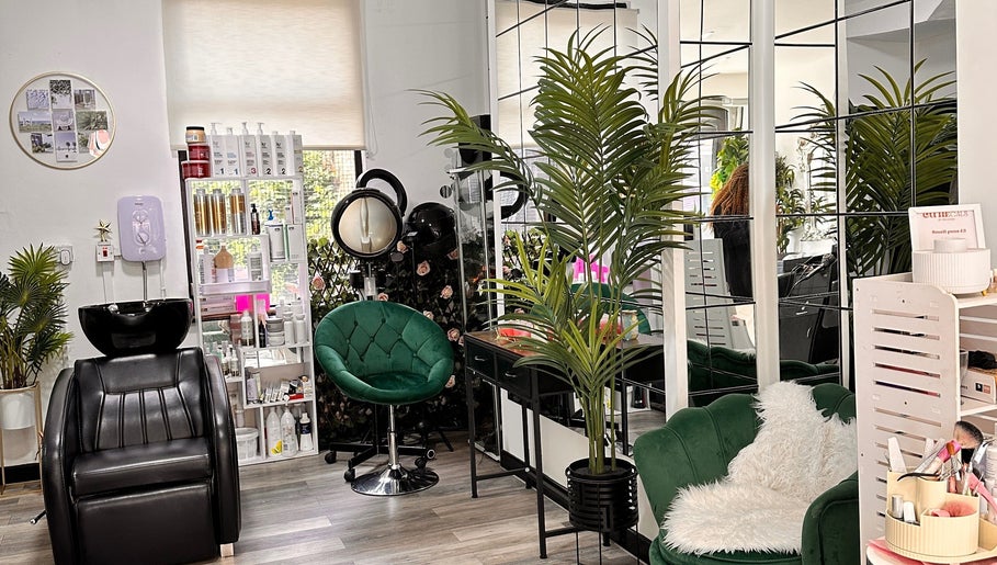 A relaxed corner of Ella Hair & Beauty Salon with plants and a styling chair