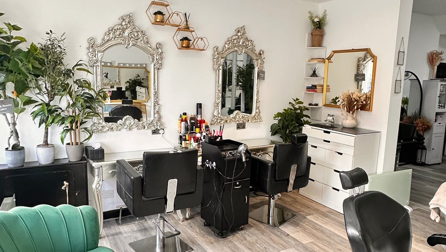 Styling stations and mirrors inside Ella Hair & Beauty Salon